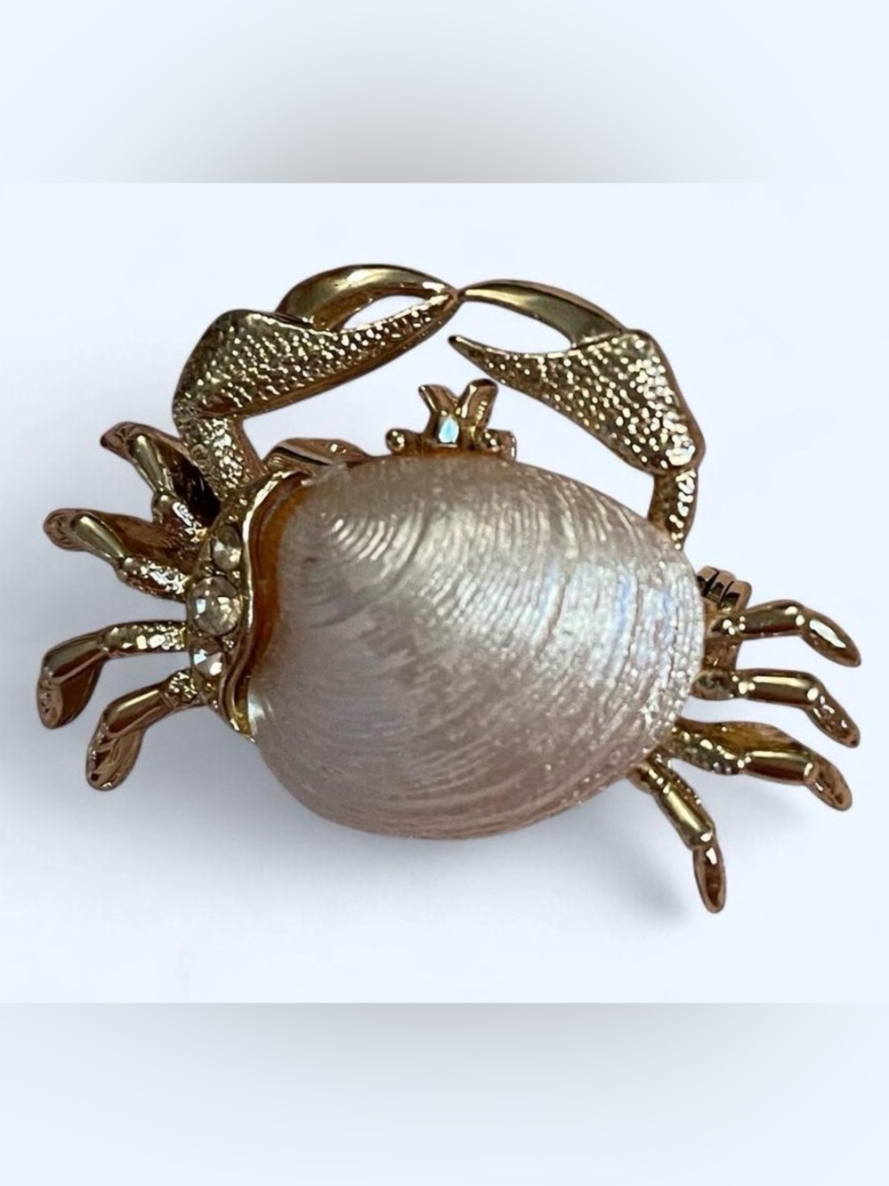 Vintage gold crab brooch with pearl body and rhinestone accents